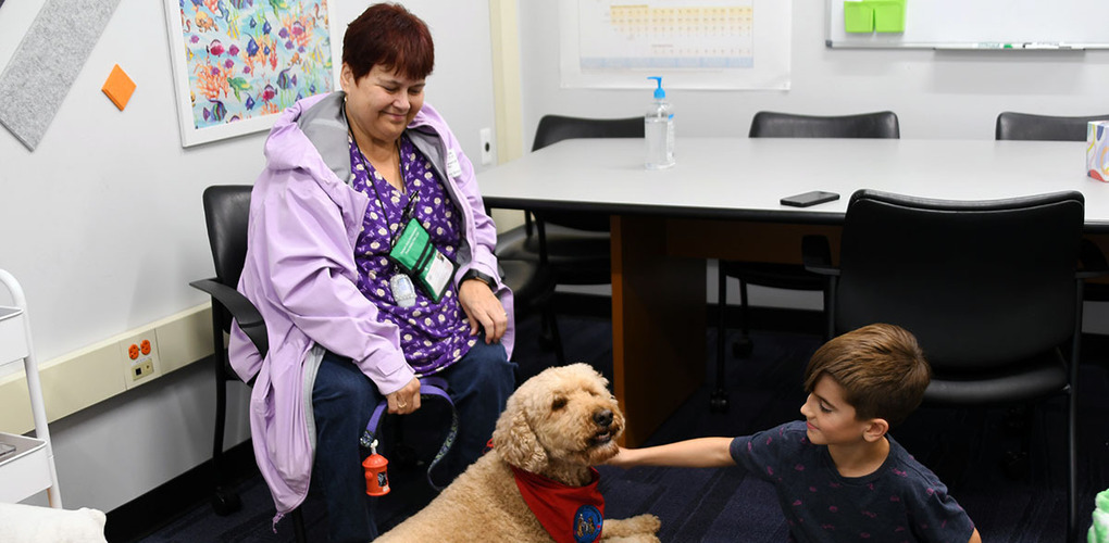 Angell students spending time with therapy dogs