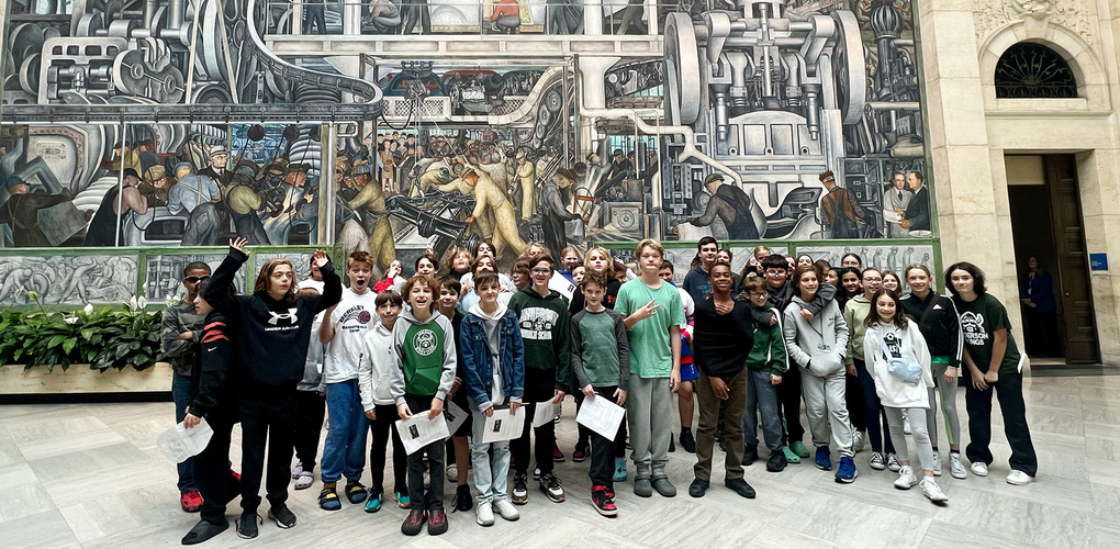 Anderson students visiting the DIA and taking pictures in front of painting