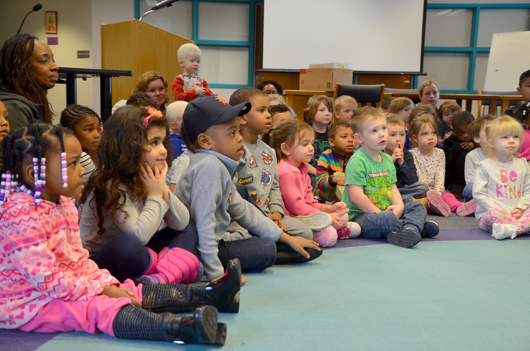 Students listening to reader