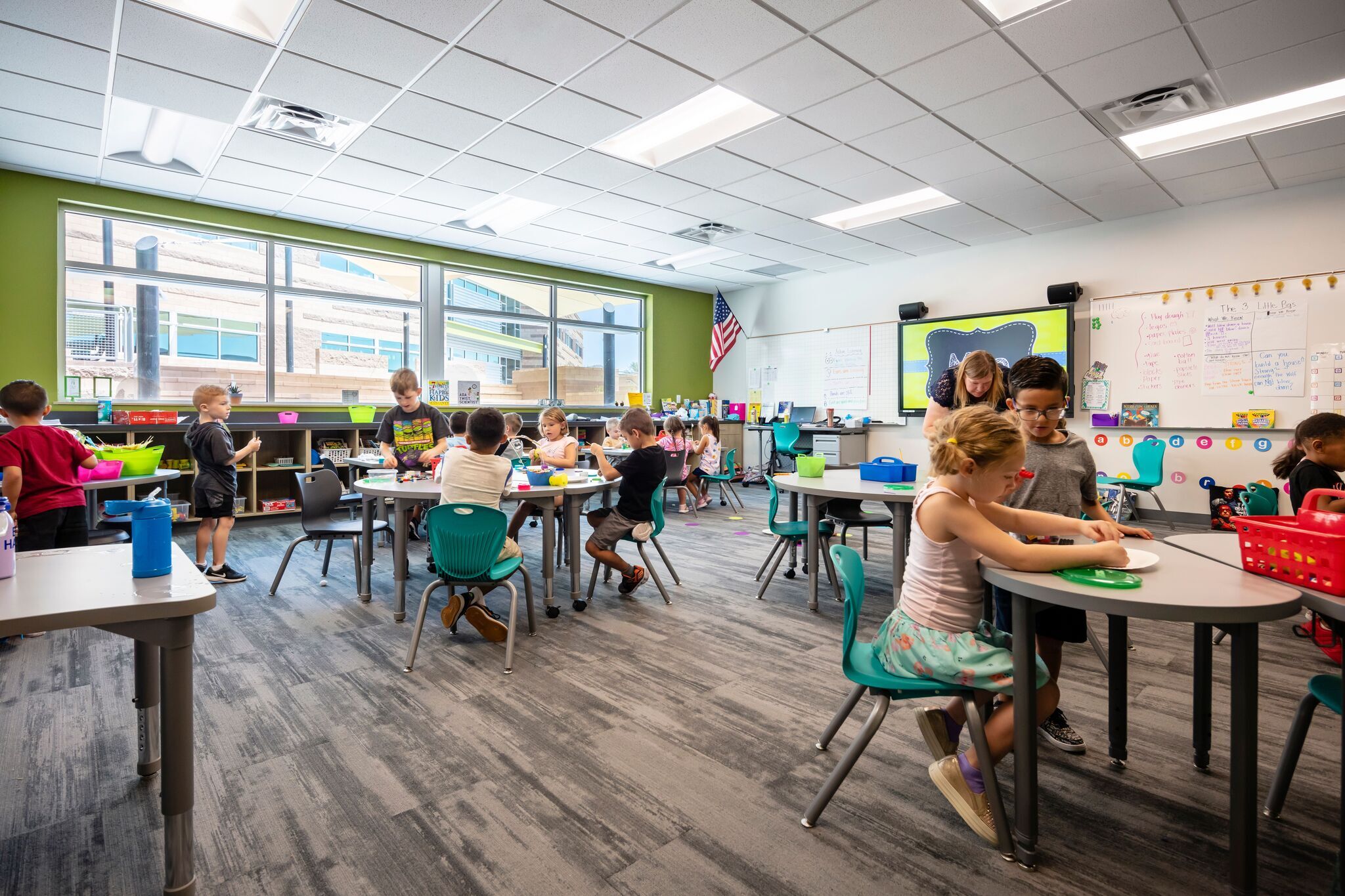 Image depicts students sitting in flexible seating inside of an elementary classroom.