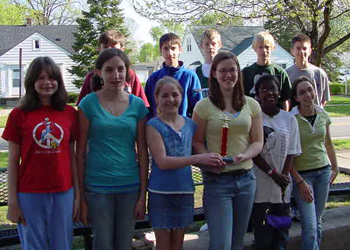 Elementary students holding a trophy in the 2000s